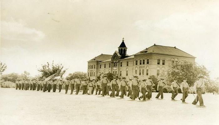 Cadets march past Main Building, circa 1942-1946.